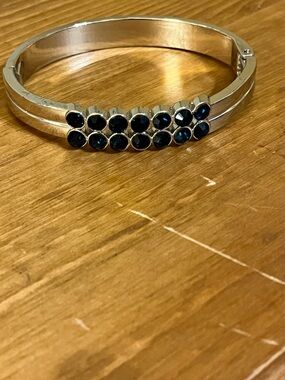 Blue in the light rhinestones silver tone bracelet hinged with side opening 7”